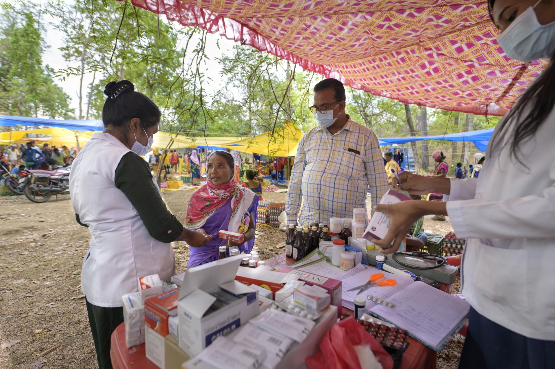 Rural public health outreach with medicines and community members
